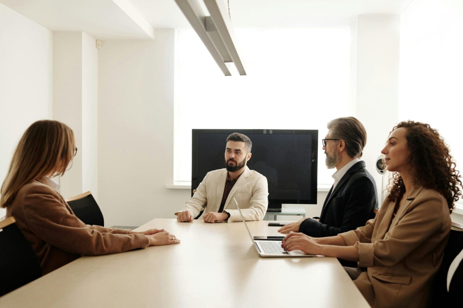 A group of people sitting around a table.